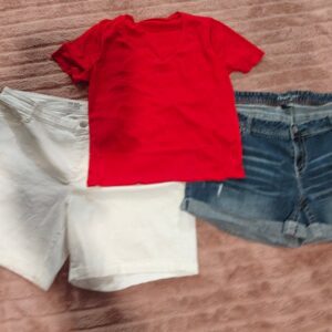 Two pair of shorts size 24, and a red shirt size extra extra large