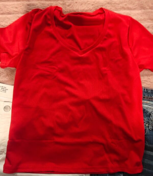 Two pair of shorts size 24, and a red shirt size extra extra large - Image 3